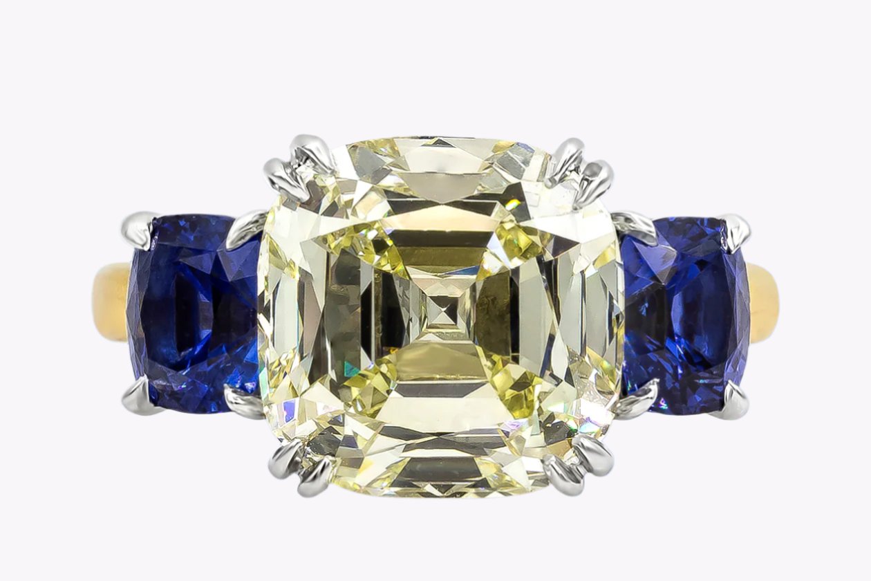 GIA Certified 7.20 Carats Antique Cushion Cut Diamond Three-Stone Engagement Ring in Platinum & Yellow Gold