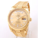 Rolex Day-Date 40 228238 18k Yellow Gold Champagne Baguette Diamond Dial